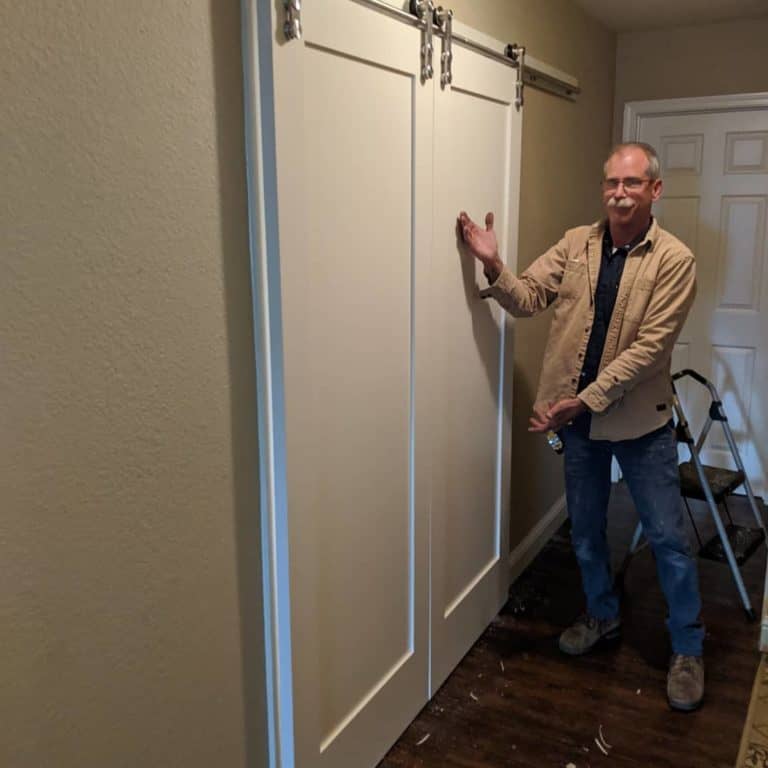 frank, handyman at honest lee handyman in sacramento, installs sliding barn doors in home